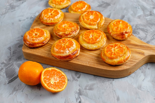 Free Photo | Homemade puff pastry with tangerine slices.