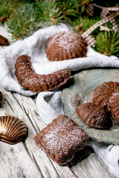 Premium Photo Homemade Traditional Christmas Shortcrust Cookies Chocolate Crescents With Cocoa Icing Sugar In Ceramic Plate With Cookie Molds Fir Tree Xmas Stars Decorations Over Wooden Background