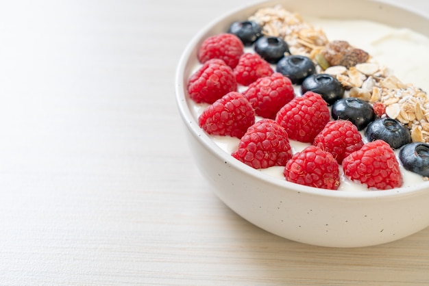 Premium Photo | Homemade yogurt bowl with raspberry, blueberry and ...