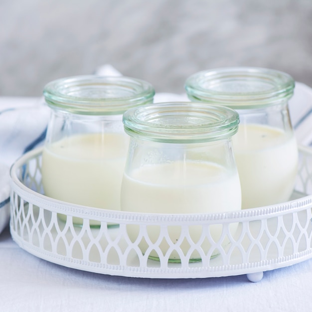 Premium Photo Homemade yogurt in glass jars