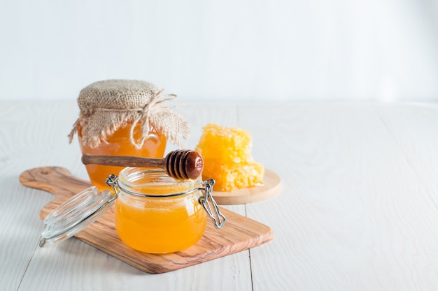 Premium Photo | Honey with honey dipper
