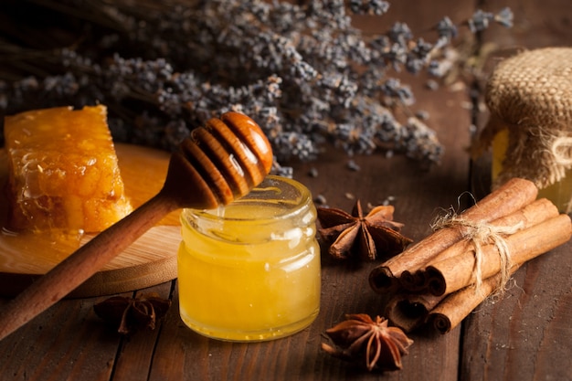 Honey on wooden background. Premium Photo