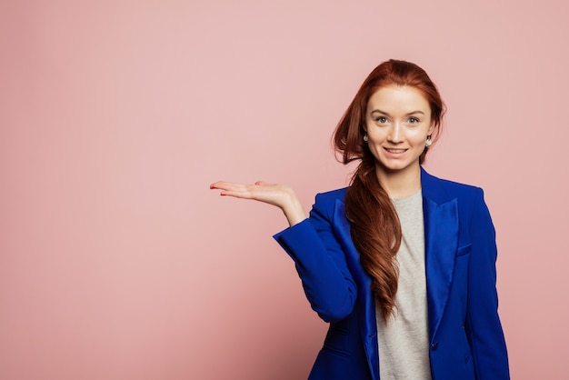 Premium Photo | Horizontal portrait of happy female model indicates ...