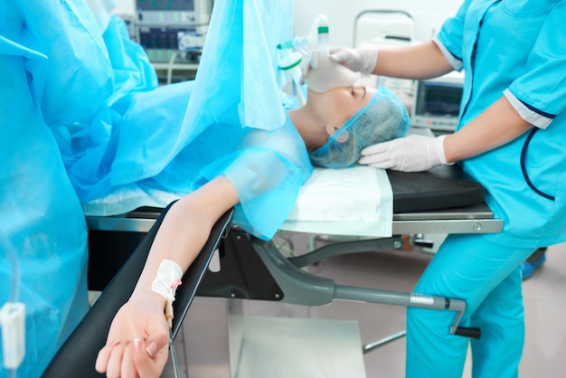 Premium Photo Horizontal Shot Of A Female Patient Lying On The Operating Table At The Surgery