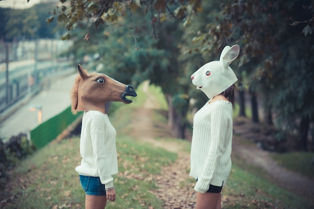 Premium Photo | Horse and rabbit mask young couple beautiful women girls
