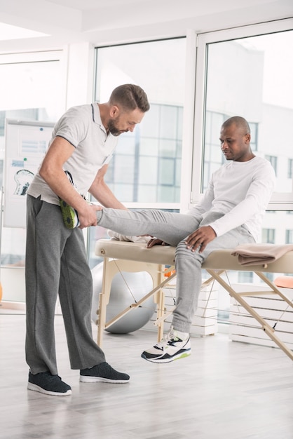 Premium Photo | In the hospital. professional male doctor holding ...