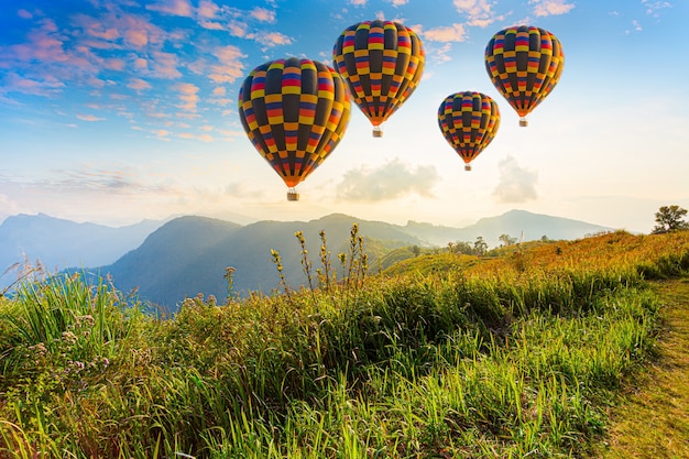 Premium Photo | Hot air balloons and mountains and beautiful ...