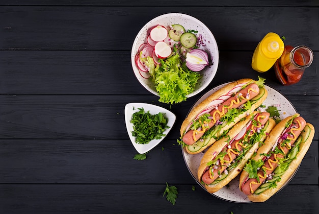 Premium Photo | Hot dog with sausage, cucumber, radish and lettuce