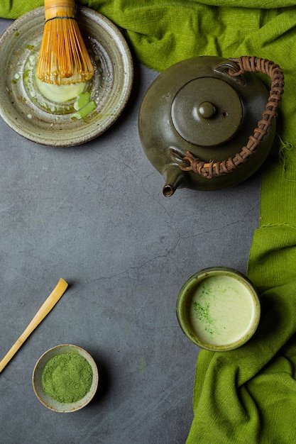 Free Photo | Hot green tea in a glass with cream topped with green tea ...