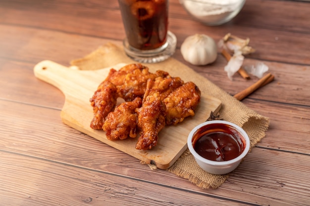 premium-photo-hot-and-spicy-korean-barbeque-fried-chicken-on-wood