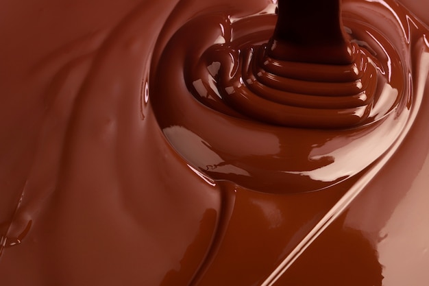 ホットスワールチョコレート背景 スプラッシュ液体ココア プレミアム写真