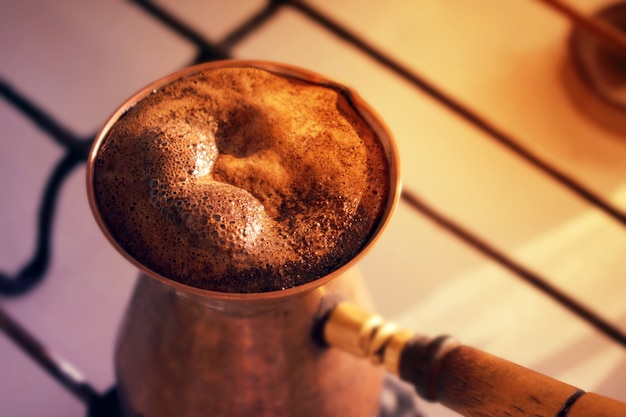 Premium Photo Hot Turkish Coffee Made In Sooper Cezve Traditional Coffee Pot On A Gas Stove