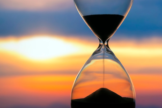 Premium Photo Hourglass Over A Sunset The Value Of Time In Life An Eternity 6705