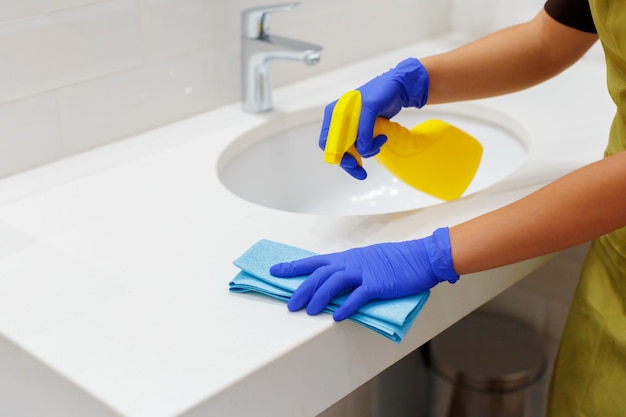 housekeeper-cleaning-a-hotel-room-premium-photo