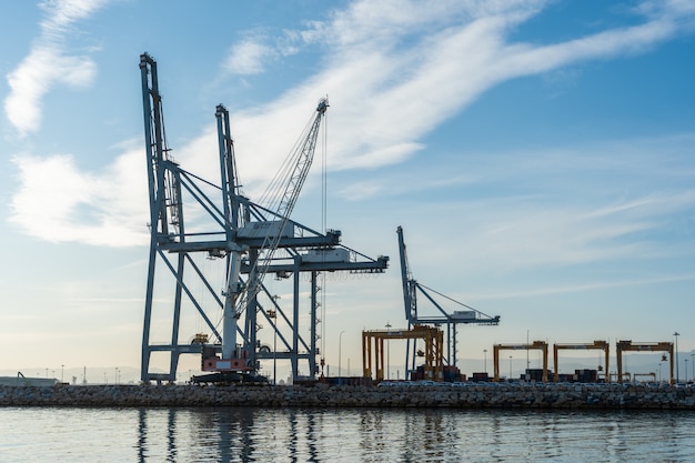 Premium Photo | Huge port cranes