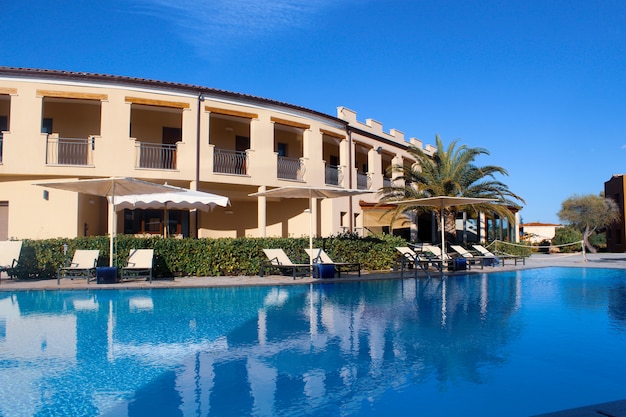 Huge swimming pool near the hotel in a resort in san teodoro, sardinia Free Photo
