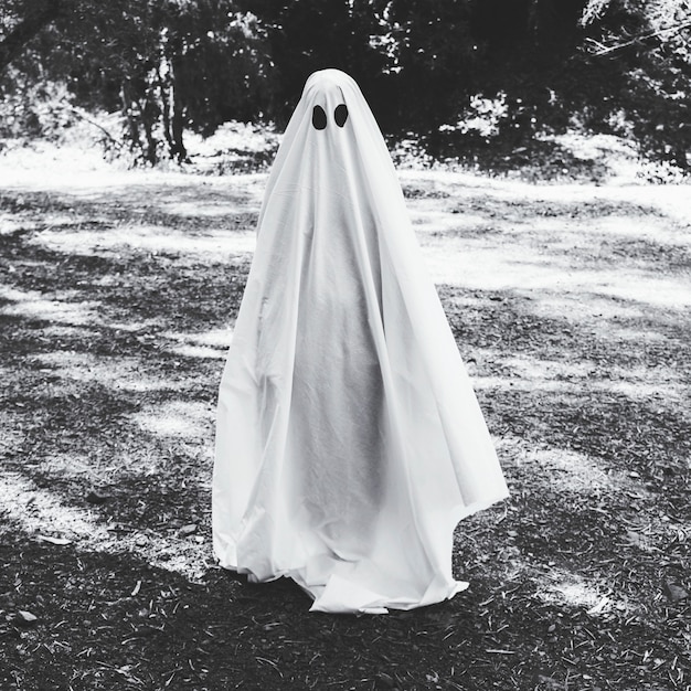 Human in ghost costume in forest | Free Photo