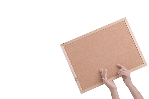 Premium Photo | Human hand holding a brown cork board in a frame ...