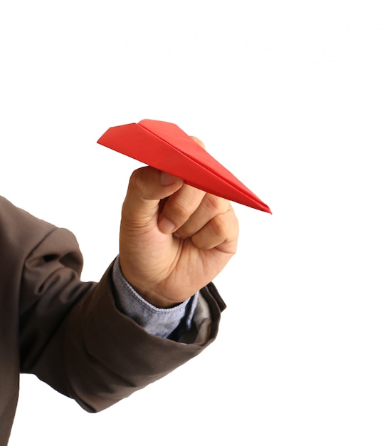 赤い紙飛行機を持っている人間の手 プレミアム写真