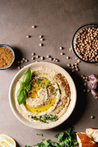 Premium Photo | Hummus with olive oil and ground cumin