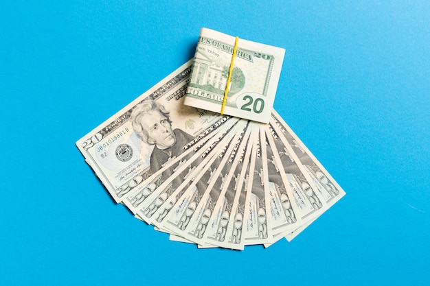 A hundred dollar currency fan close up, top view of business on colored with copyspace Premium Photo