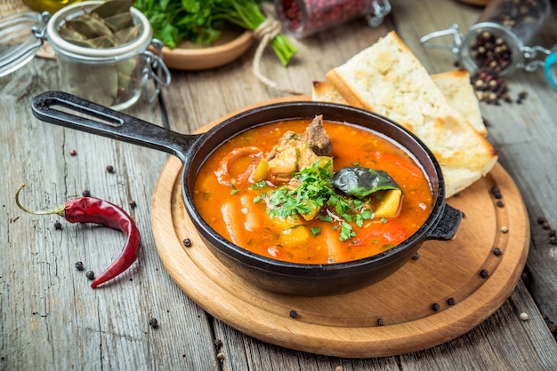 Premium Photo | Hungarian soup goulash bograch with dumplings, on the table