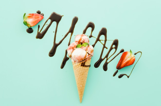 Ice cream in waffle cone with chocolate syrup Free Photo