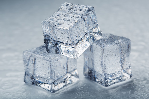 Premium Photo | Ice cubes in the form of a pyramid with water drops ...