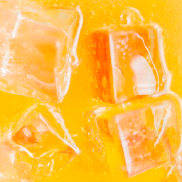 Ice Cubes In Orange Liquid Photo Free Download 7023