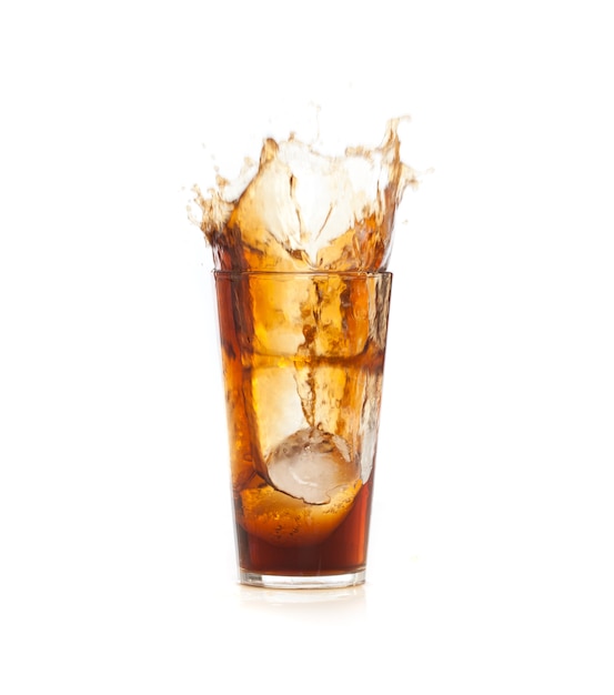 Free Photo | Ice falling in a brown drink