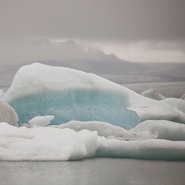 Premium Photo | Iceberg floating in glacial lake