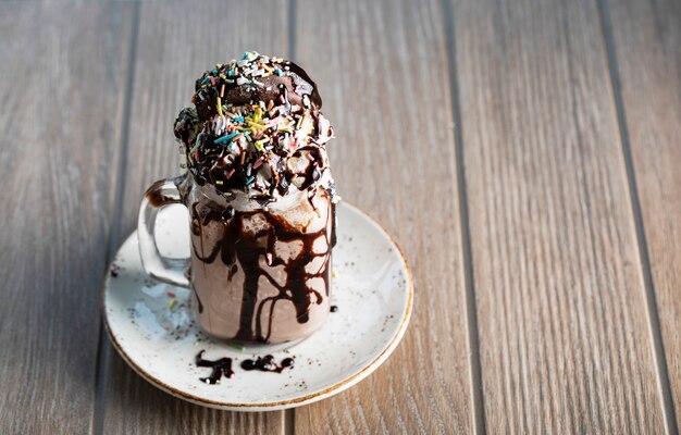 Free Photo Icecream Dessert With Bitter Chocolate Sauce And Profiterol Tops