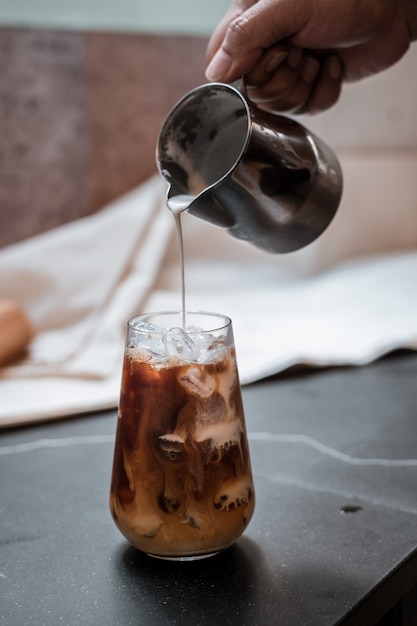 Premium Photo | Iced coffee put on black table