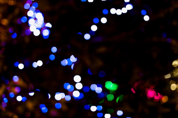 Free Photo | Illuminated color dot with darkness background