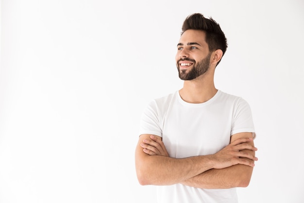 Premium Photo | Image of attractive young man smiling and looking aside ...