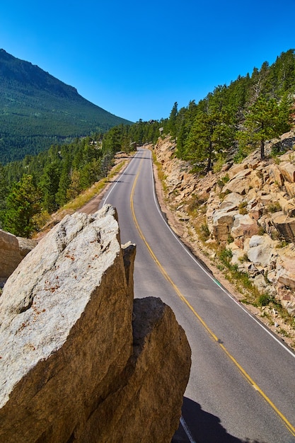 Premium Photo | Image of vertical road cutting through mountains next ...