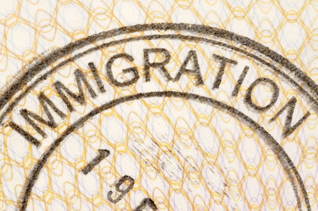Immigration passport stamp Free Photo