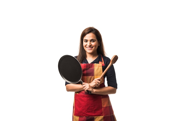 Premium Photo Indian Or Asian Woman Chef Wearing Apron And Holding Pan And Spatula While 