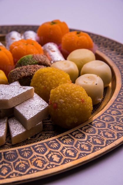 Premium Photo | Indian festival assorted sweet food or mithai on white ...