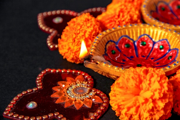 Premium Photo | Indian festival diwali , diwali lamp and flower rangoli