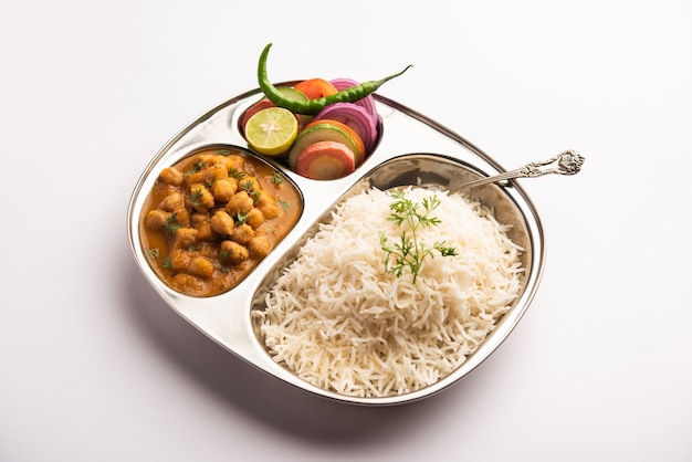 Premium Photo | Indian food chole chawal or spicy chickpea curry with ...