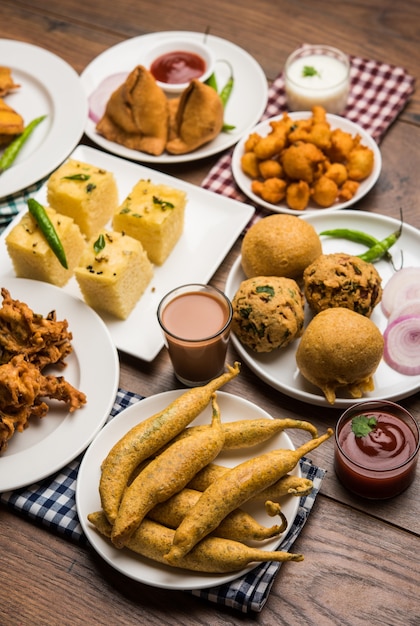 Premium Photo | Indian tea time snacks in group includes veg samosa ...