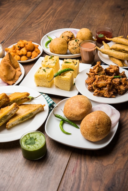 Premium Photo | Indian tea time snacks in group includes veg samosa ...