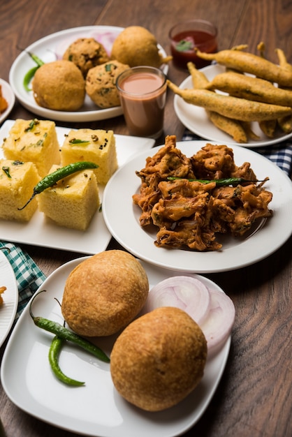 Premium Photo | Indian tea time snacks in group includes veg samosa ...