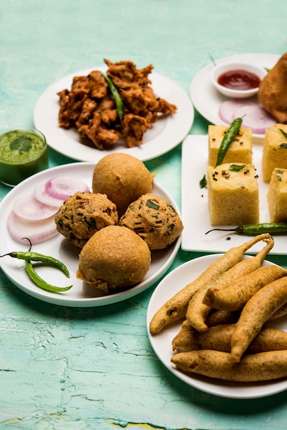 Premium Photo | Indian tea time snacks in group includes veg samosa ...