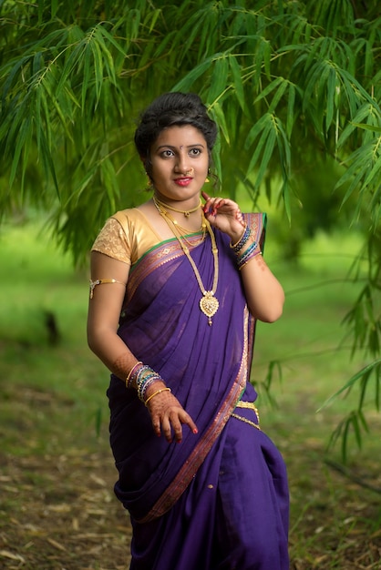 Premium Photo | Indian traditional beautiful young girl in saree posing ...