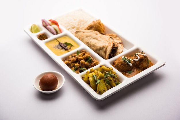 Premium Photo | Indian vegetarian food thali or parcel food-tray with ...