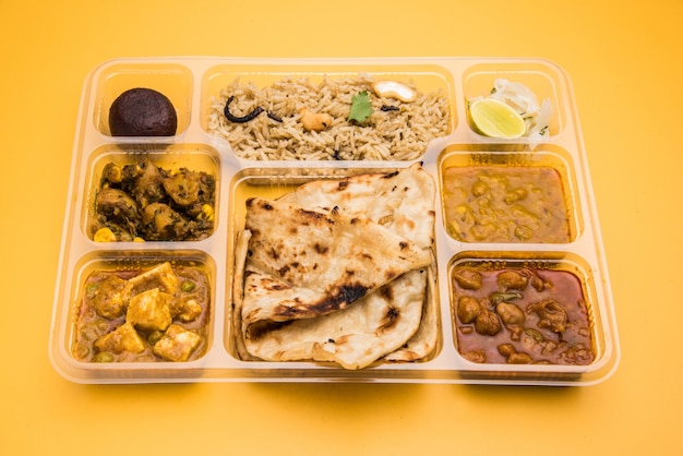 Premium Photo | Indian vegetarian thali or food platter for parcel or ...