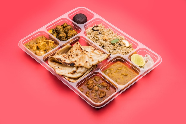 Premium Photo | Indian vegetarian thali or food platter for parcel or ...