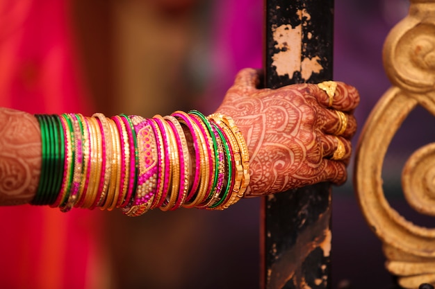 Premium Photo | Indian wedding ceremony : bangle in bridal hand with ...